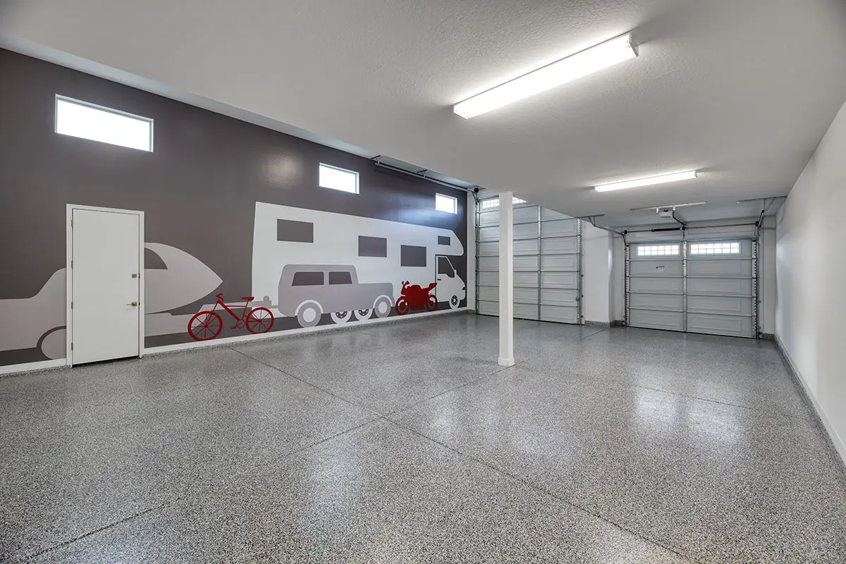 RV garage interior with large vehicle decals on the wall