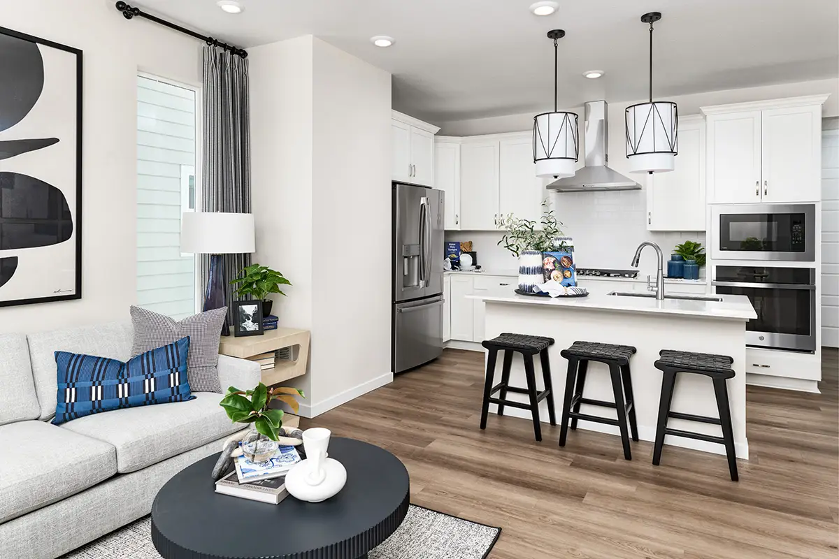 Kitchler black wrought iron and white pendent lights in kitchen