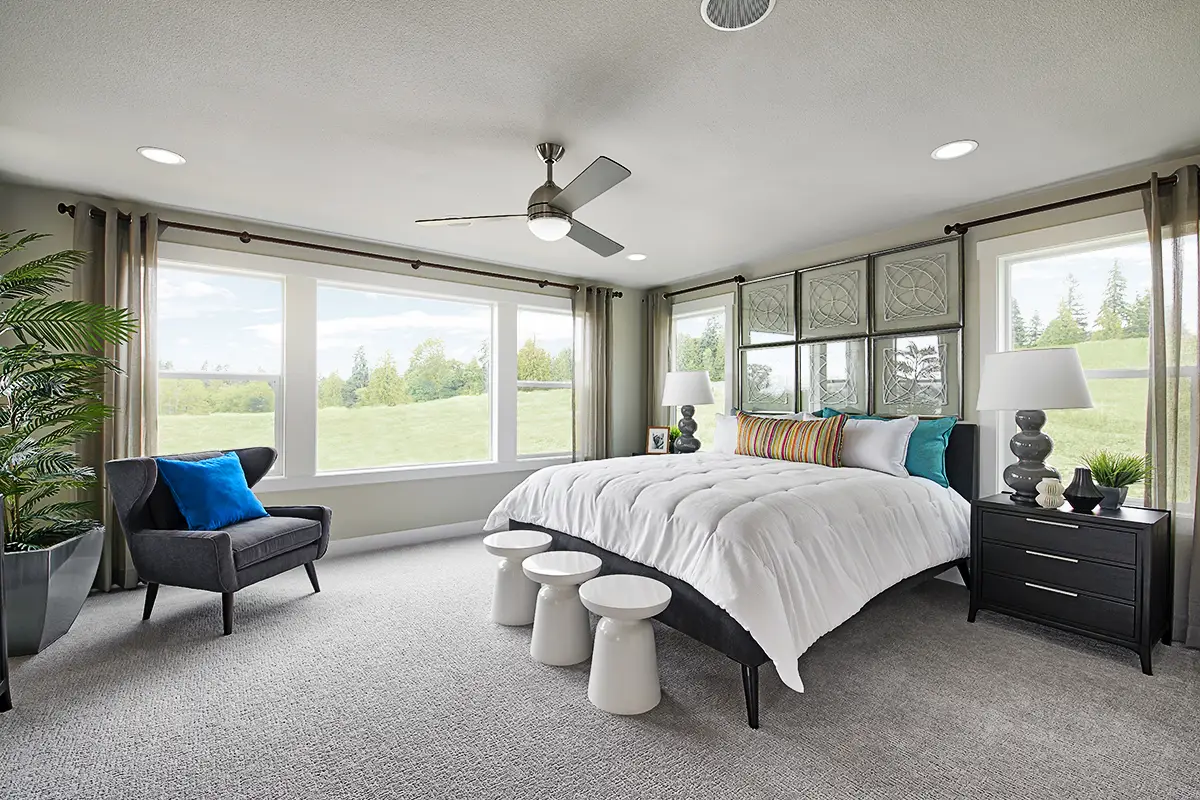 Primary bedroom with bed and Mohawk carpet