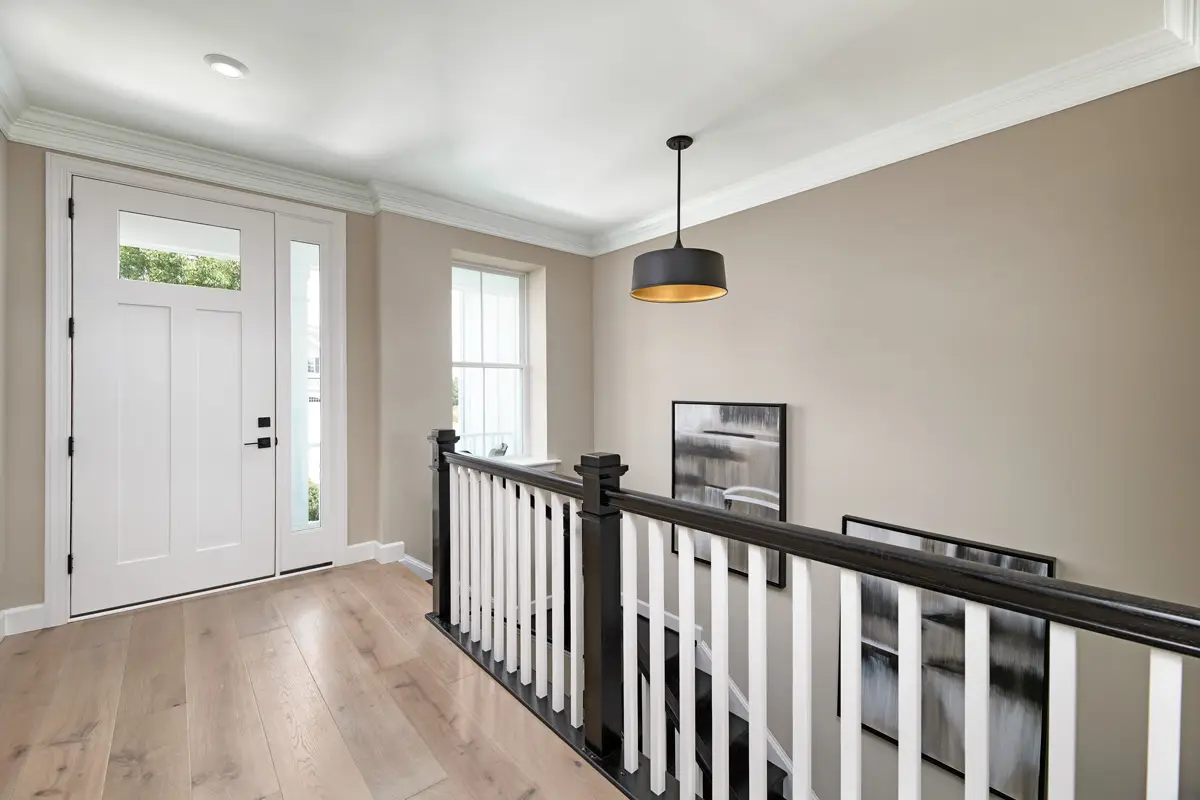 Front entry of home with light tan color walls